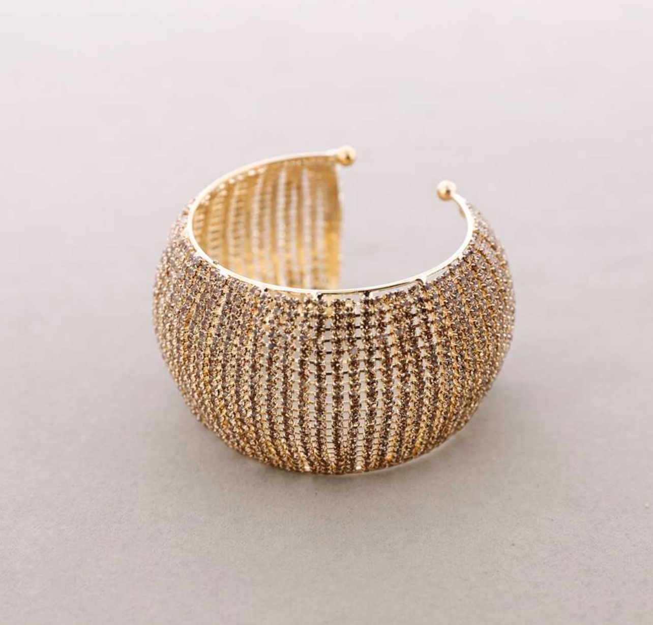 Brazalete circonitas champagne , oro